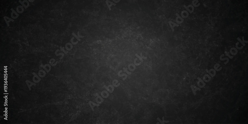 Dark charcoal grunge wall texture background. Dark black rough grunge surface with smoke edge. Black texture chalk board and black board.