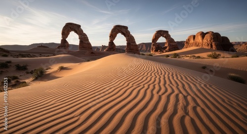 AIzaSyDYhUdgNx4KeAqBx9v1E4jNZWrZTlvS3bI Arches National Park desert sandstone formations and sand dunes at sunrise