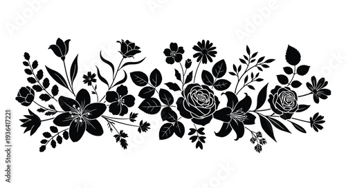 Black and white floral arrangement with roses lilies and various blossoms