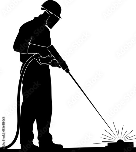 Industrial worker welding metal with a torch creating sparks