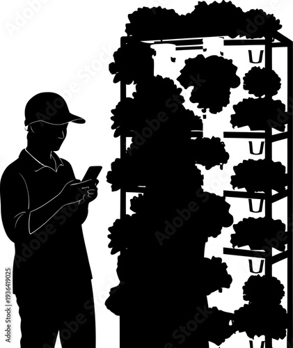 Agricultural technician using a smartphone to monitor vertical farming plants