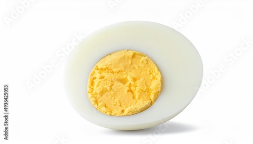 A halved, hard-boiled egg reveals a golden yolk against a white background