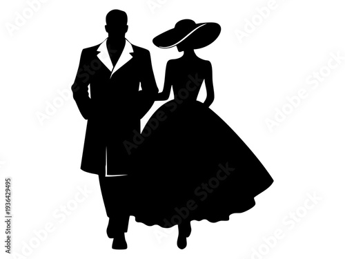 A man and woman in formal attire walk together outdoors at night