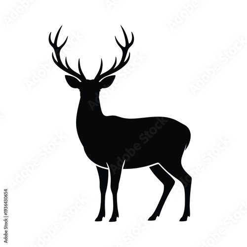 A striking silhouette of a majestic stag with large antlers