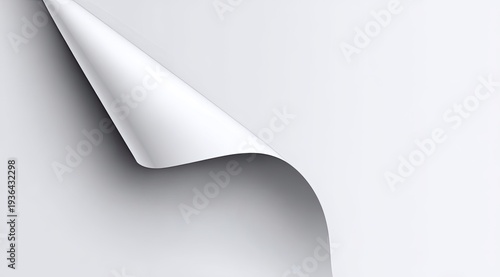 A white paper page with a curved corner peeled back, casting a soft shadow
