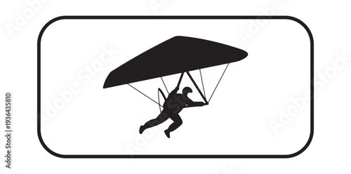A person in silhouette is flying through the air with a hang glider in a peaceful and serene atmosphere silhouette
