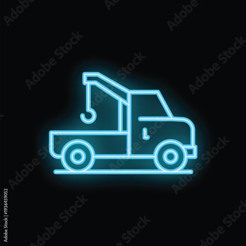 Blue neon sign is glowing against a black background, illustrating a tow truck