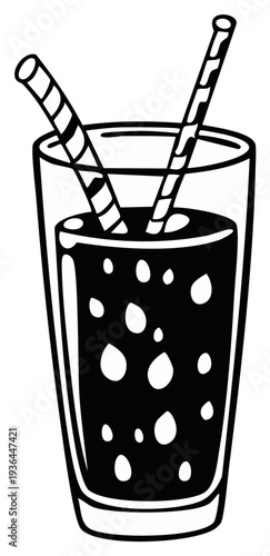 Tall glass of dark liquid with two striped straws and ice cubes