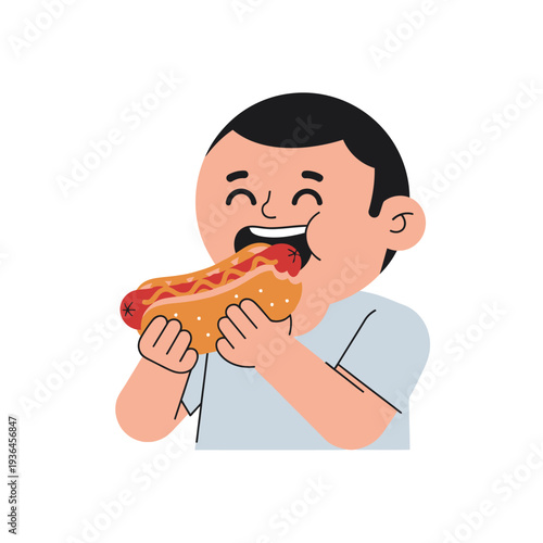 Happy boy eating a delicious hot dog with ketchup and mustard, enjoying a tasty snack.