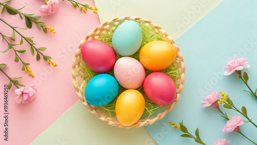 Basket holds colorful eggs on pastel background with flowers during Easter celebration in springtime