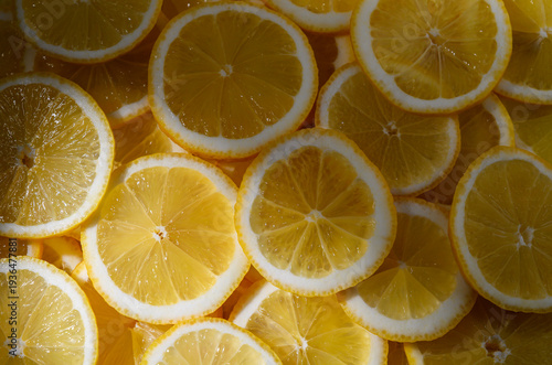 Lemon rounds spread out on table