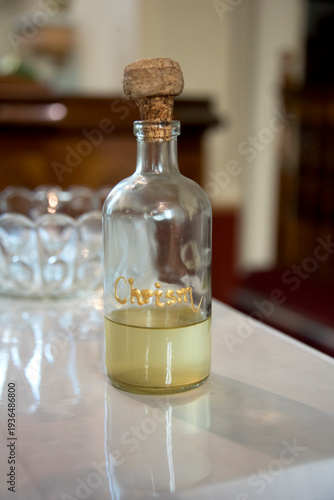 Cuadro en lienzo Chrism oil bottle with golden script for religious ceremony, showing sacred anoi