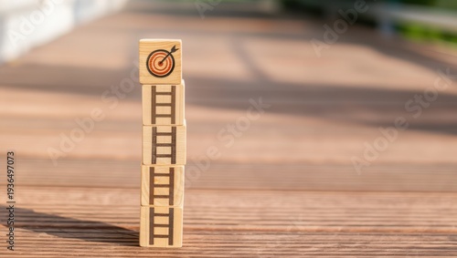 A stack of wooden blocks with a target on top