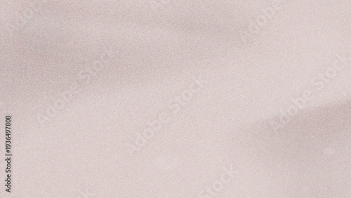 Soft pastel pink fabric texture with subtle glitter and gentle shadows close up detail