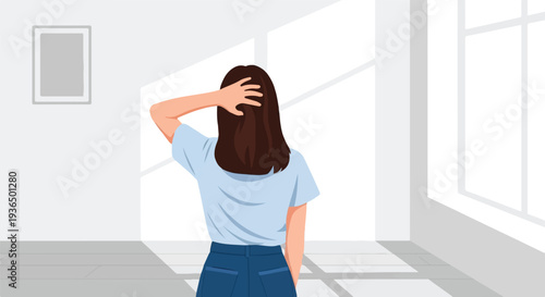 Back view of a person with their hand on their head standing in a brightly lit room with shadows on the floor and wall