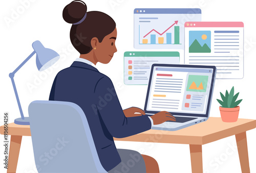 A woman sits at a desk working on a laptop with graphs and charts displayed.