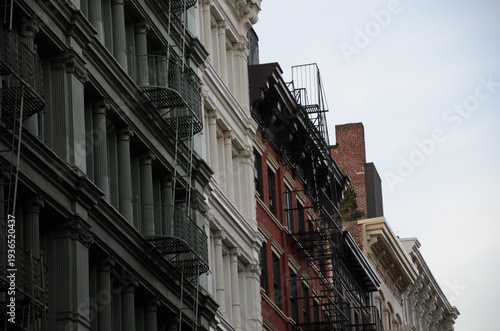 Tableau sur toile Traditional New York Apartment Buildings with Fire Escapes