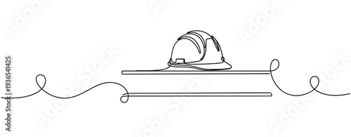 Construction helmet resting on flat surface with line. No editable stroke