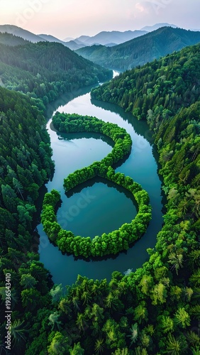 Winding river carves through lush, forested mountains