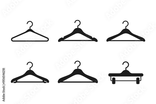 Collection of six different black clothes hangers on a white background