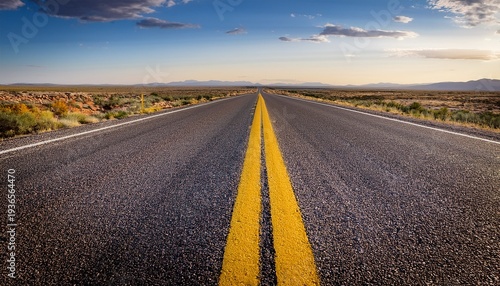 Open Road Ahead A Straight Asphalt Road Marked With Vibrant Yellow Lines Stretches Into The Distance Suggesting A Journey Full Of Possibilities