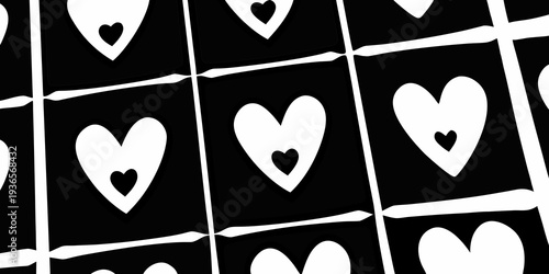 Close up of black cards with white heart shapes arranged in a grid