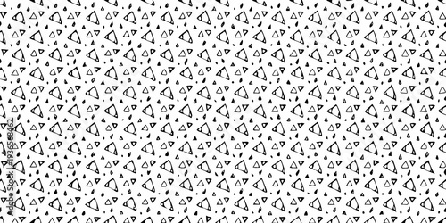 A dense repeating pattern of abstract triangular shapes in black and white