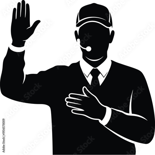 Referee official raising hand with microphone and hand on chest signaling during sports match