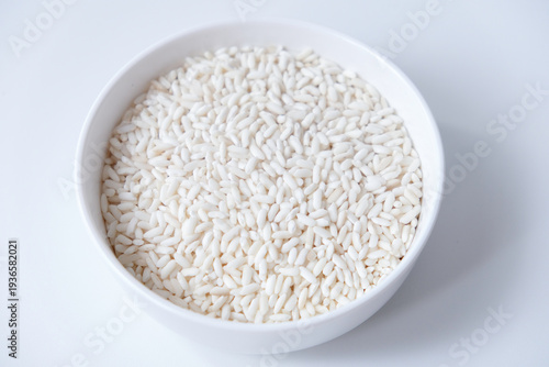 Wallpaper Mural A bowl of white sticky rice grains isolated on white background Torontodigital.ca