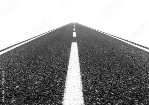 Asphalt road with white lines receding into darkness
