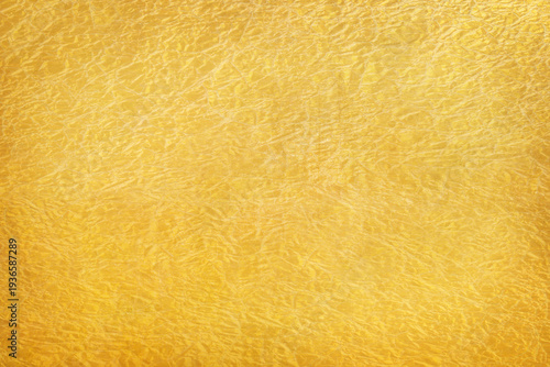 Shiny yellow leaf gold foil texture background