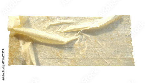 Creased yellowish white tissue paper with torn edges isolated on a transparent background
