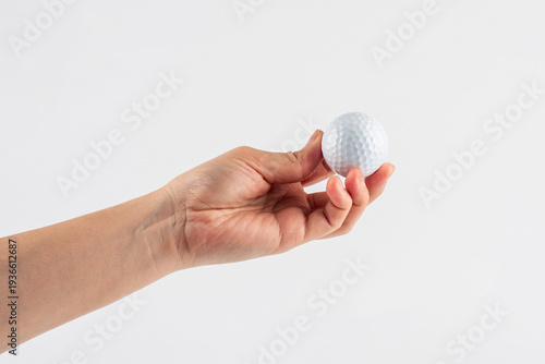 Wallpaper Mural Golf ball in hand, white background. Torontodigital.ca