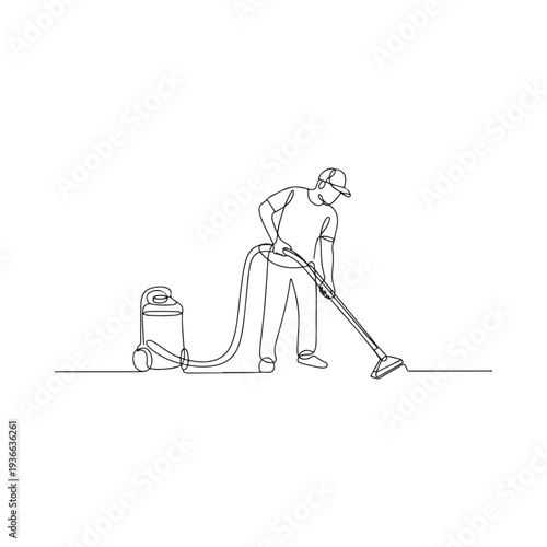 A person kneels while packing a suitcase with various travel items