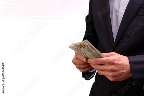 Foto Man businessman holding dollars during economic crisis and financial problems