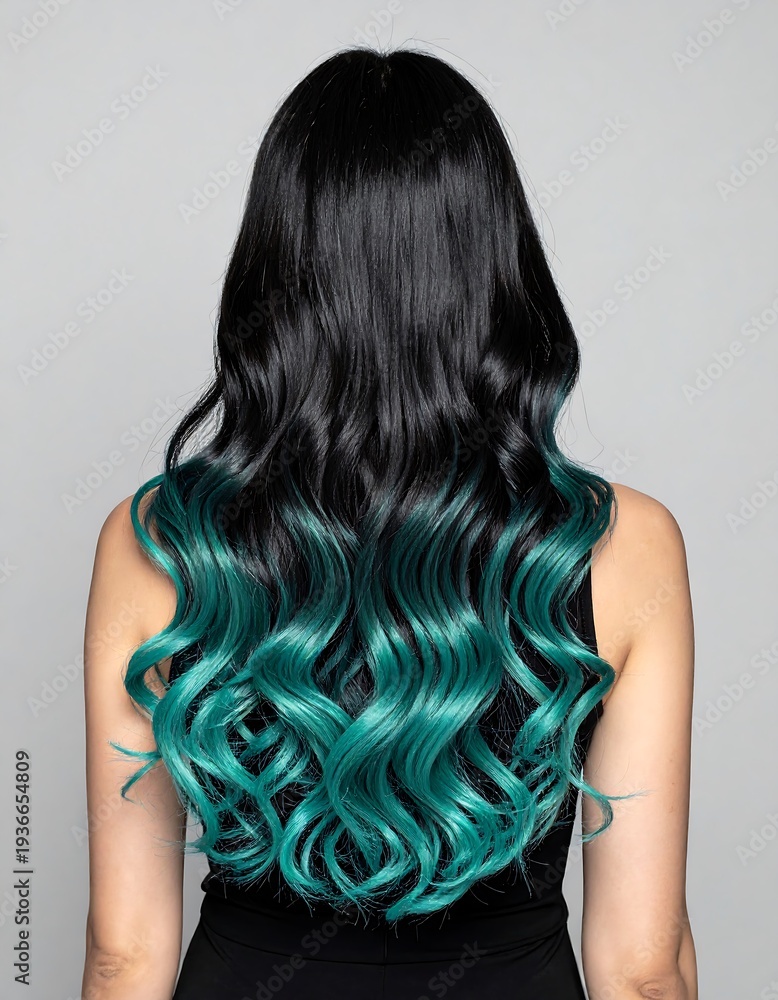 Fototapeta premium Back view of a person with black hair transitioning into turquoise waves