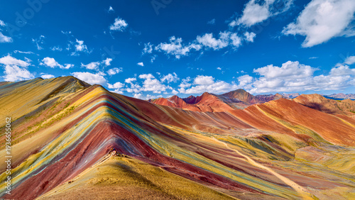 Surreal Rainbow Colored Mineral Mountains with Vivid Stripes and Winding Desert Paths
