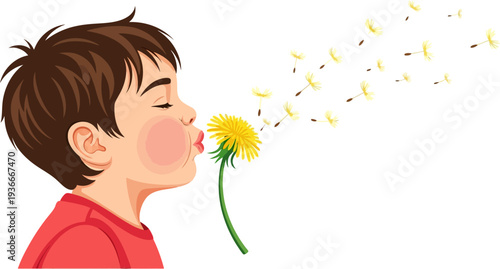 Young boy blowing dandelion seeds into the wind