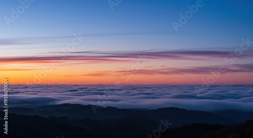 Amazing panoramic dawn or dusk sky with smooth, colorful, gentle clouds stretching across the horizon, dusk, glow, yellow