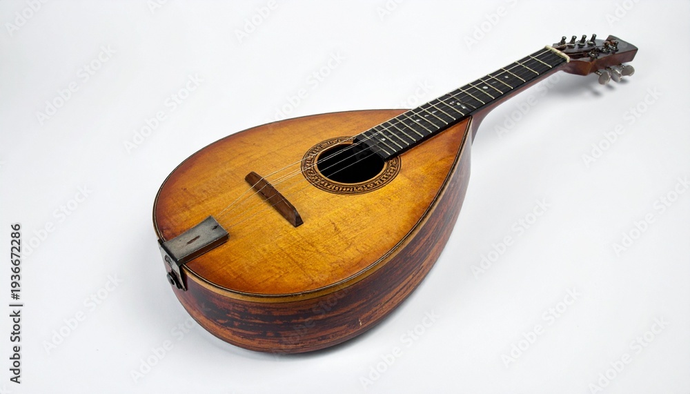 Fototapeta premium Amber Wooden Mandolin with Teardrop Body, Round Sound Hole, and Eight Strings