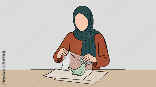Woman in Green Hijab and Orange Blouse Carefully Unwrapping a Small Green Bird Figurine from Protective Packaging on a Wooden Table