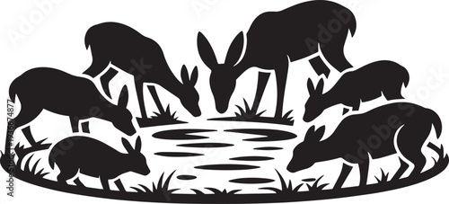 Herd of deer drinking water from pond surrounded by grass