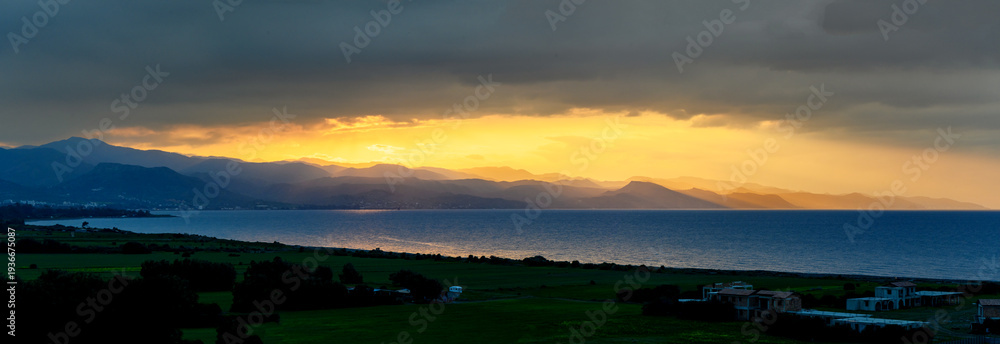 Fototapeta premium Sunset over Mediterranean Sea from rooftop view