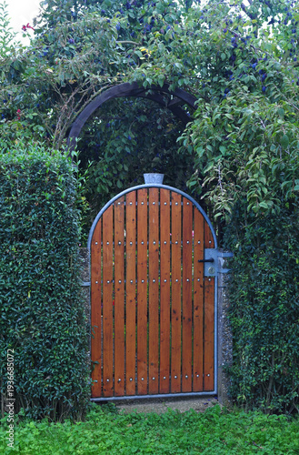 Wooden Garden Gate and Arched Pergola