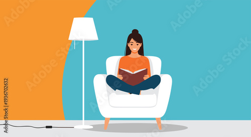 Relaxed woman sitting in a white armchair reading a book under the warm light of a floor lamp in a cozy home interior setting.