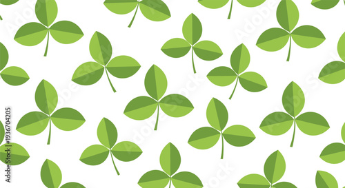 Green nature pattern of three leaf clovers or shamrocks scattered across a white background for luck and Irish themes.