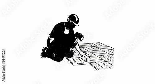 Worker installs flooring with a mallet