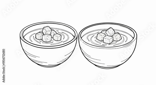Two bowls of soup with croutons, illustrated in black and white