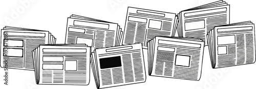 A collection of black and white newspaper pages are fanned out across the frame