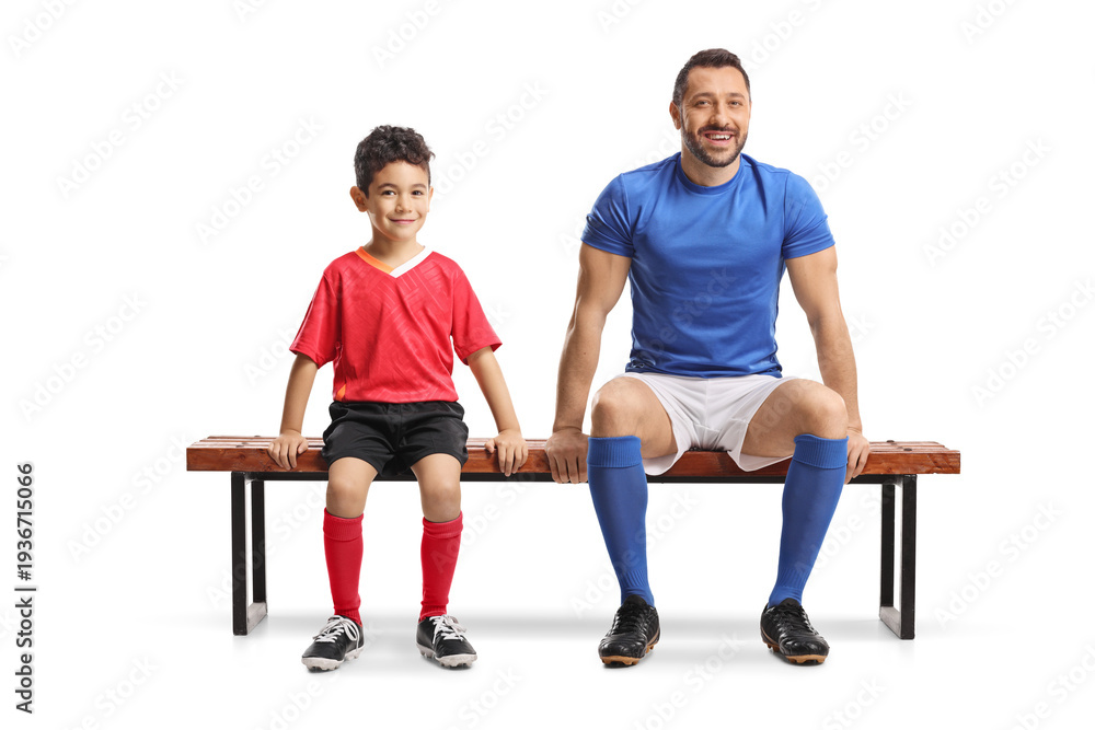 Obraz premium Adult football player and a boy sitting on a bench